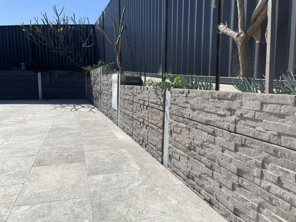 Concrete sleeper retaining wall with galvanised steel posts on a residential site in East Maitland
